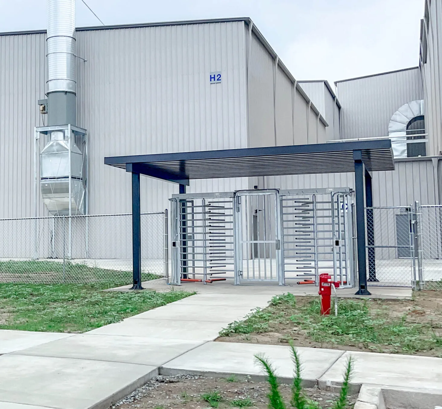 Quintain turnstile — high-security pedestrian gate with contactless palm vein verification, in use at a chemical plant deployment